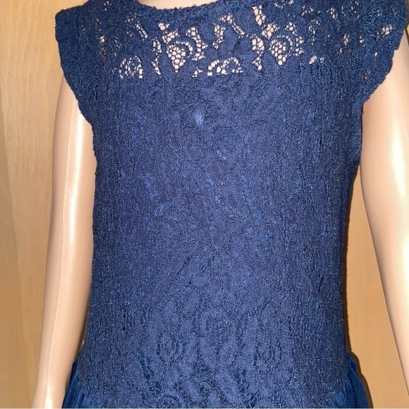 Guess Los Angeles baby lace dress has a gauze skirt just perfect for twirling. - Picture 2 of 8